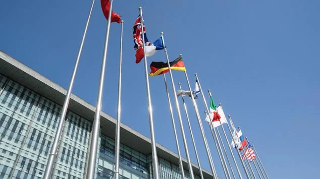 Flags outside of main campus building | DMF Clinic